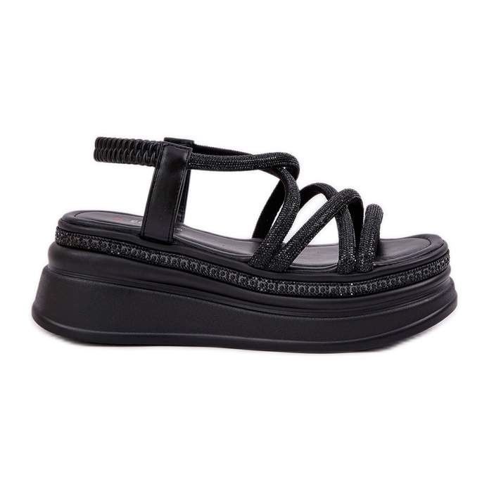 Sandalias en una plataforma masiva con rayas negras negro