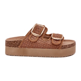 Zapatillas con trenza y hebillas en la plataforma de camello masiva beige