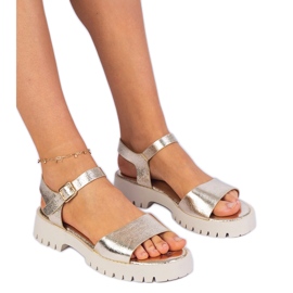 Sandalias de oro con lúculas doradas dorado
