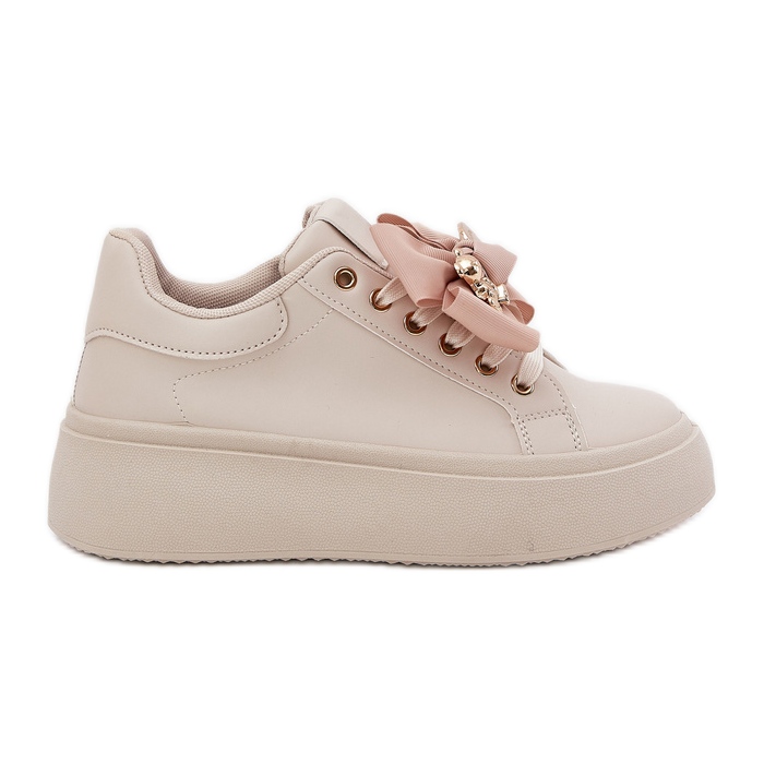 Zapatillas de deporte para mujeres con arco y un broche con un oso de peluche beige