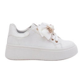 Zapatillas de deporte para mujeres con arco y un broche con un oso de peluche blanco