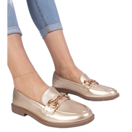 Mocasines de mujeres doradas con decoración dorada dorado