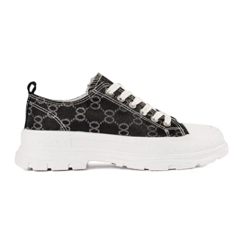 Zapatillas negras en la plataforma con decoraciones negro Zapatillas negras en la plataforma con decoraciones negro