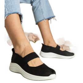 Zapatillas de deporte de mujeres negras en una suela prensada negro
