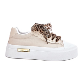 Zapatillas para mujeres en una plataforma masiva con beige decorativo de cordones