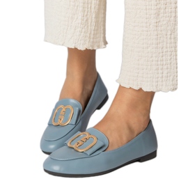 Mocasines de mujer azul con una decoración dorada