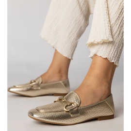 Ballerinas doradas mujeres elegantes con un adorno dorado Ballerinas doradas mujeres elegantes con un adorno dorado