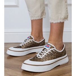 Zapatillas de deporte para mujeres marrones en la plataforma marrón