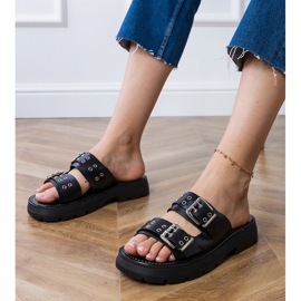 Chanclas negras planas con abrazaderas en rayas negro