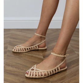Sandalias planas de mujeres beige construidas