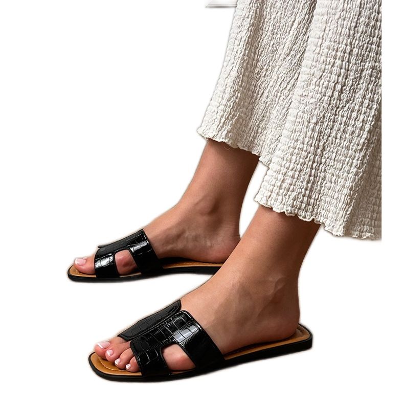 Chanclas negras planas con presión negro