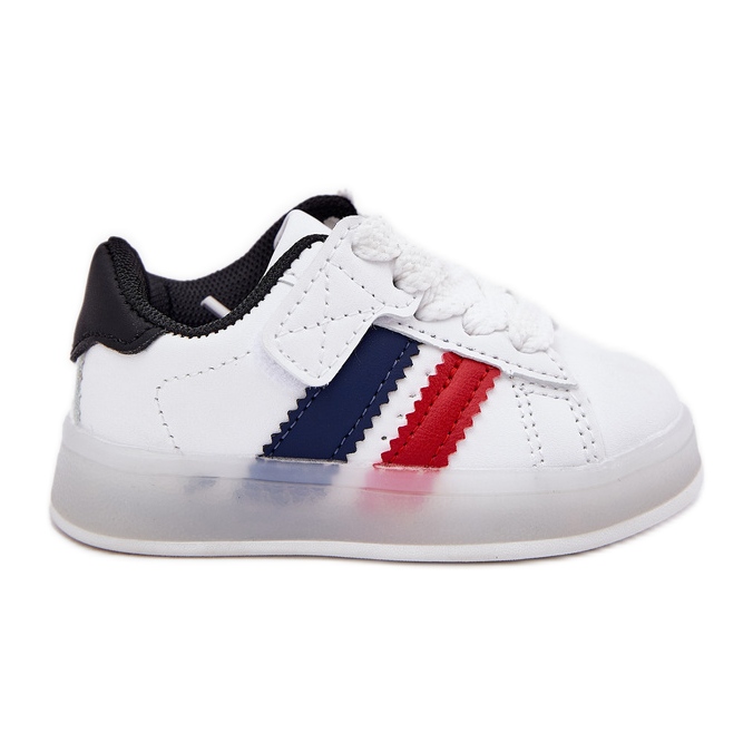 Zapatillas deportivas de zapatillas para niños con una brillante suela blanca y blanca blanco