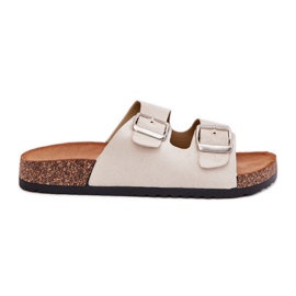 Zapatillas para mujeres en una plataforma de corcho con hebillas beige