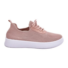 Material zapatos deportivos atacados en la plataforma rosa femenina rosado