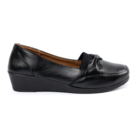 Zapatos corredizos negros con arco