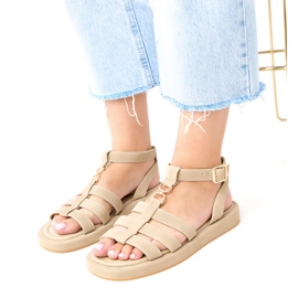 Sandalias beige oscuras de mujeres romanas sujetas en el tobillo de Nargiz
