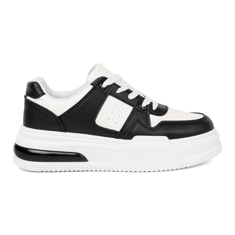 Shelvt Elegantes zapatillas en blanco y negro con una suela gruesa