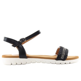 Sandalias negras con un brillo metalizado. negro