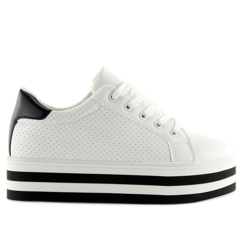 Zapatillas blancas en una suela alta blanco Zapatillas blancas en una suela alta blanco