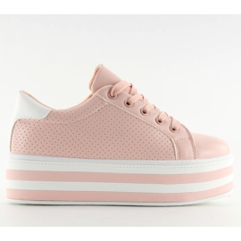 Zapatillas rosas rosas en una suela alta. rosado
