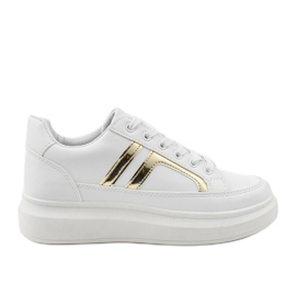 Primeras zapatillas blancas blanco dorado