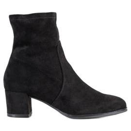 Sergio Leone Botas elegantes en un poste negro