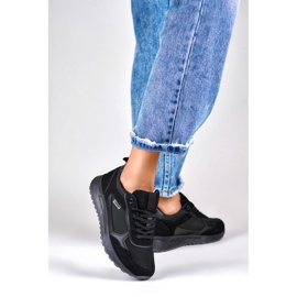 Deportivas negras de mujer con suela negra. negro 2