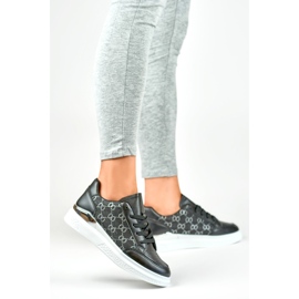 Zapatillas negras de mujer con un patrón de moda. negro 3