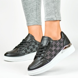 Zapatillas negras de mujer con un patrón de moda. negro 6
