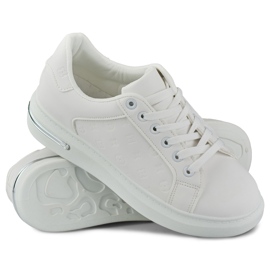 Zapatos deportivos de mujer blancos clásicos. 5