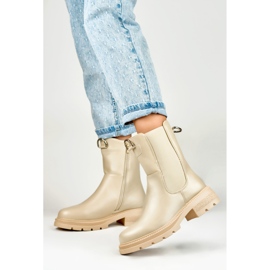 Botas clásicas de mujer beige en la plataforma. 3