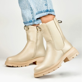 Botas clásicas de mujer beige en la plataforma. 6