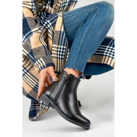 Botas planas de mujer negras fabricadas en ecopiel negro 4
