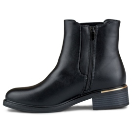 Botas negras de tacón plano para mujer fabricadas en ecopiel negro 4