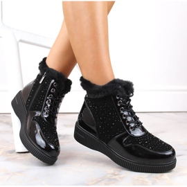 Botas de cuero con aislamiento de cuero negro Rieker 93312-00 en la plataforma 12