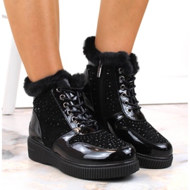 Botas de cuero con aislamiento de cuero negro Rieker 93312-00 en la plataforma 13