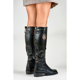 Botines de mujer con cremallera dorada. negro 3