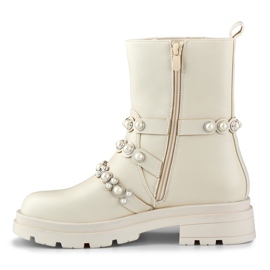 Botines de mujer beige con complementos decorativos. 4