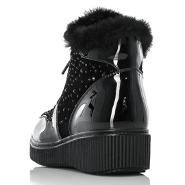 Botas de cuero con aislamiento de cuero negro Rieker 93312-00 en la plataforma 14
