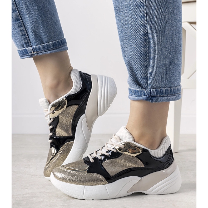 Deportivas doradas con suela alta Rude negro 1