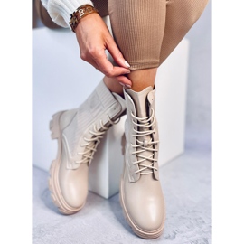 Trabajadores con una parte superior Calling Beige flexible 3