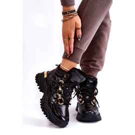 Zapatos deportivos aislados para mujeres botas de montaña con una cadena dorada negra negro 1