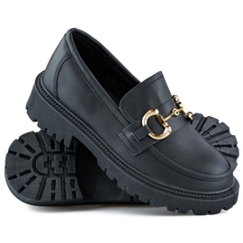 Mocasines de mujer negros con decoración dorada. 1