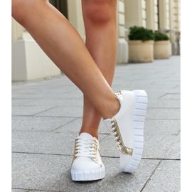 Zapatillas blancas y doradas con suela Bionda masiva. blanco 2