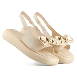 Sandalias de mujer beige con lazo de osito en la plataforma 1