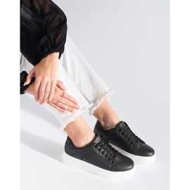 Zapatillas negras en la plataforma negro 3