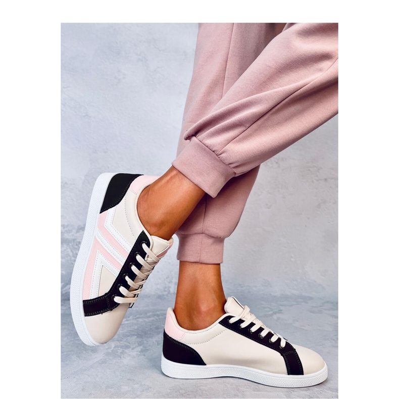 Zapatillas rosas de mujer. 1