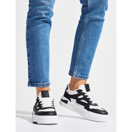 Deportivas negras y blancas con plataforma negro 2