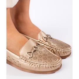 Mocasines dorados para mujer. 4