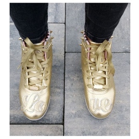 Zapatillas Reebok Betwixt Mid W V55618 dorado 18